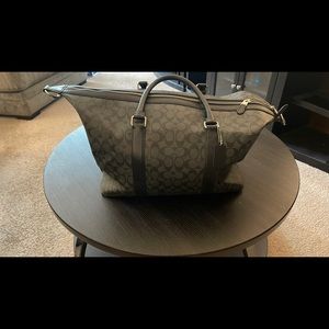 Barely used black Coach monogram style weekender bag